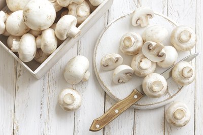 Mushrooms on plate with knife