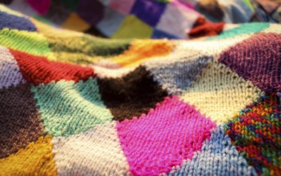 Close-up of a patchwork wool quilt.