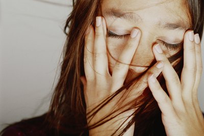 Woman holding head