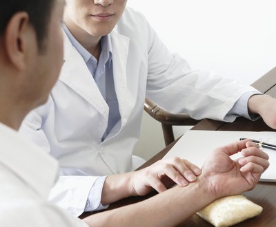 Doctor feeling man's plus