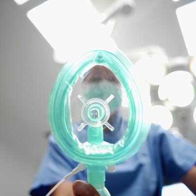 Anesthesist holding a mask