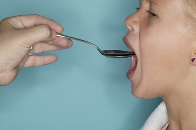 Young Girl taking medicine