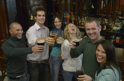 Friends toasting at Saint Patrick's day pub party