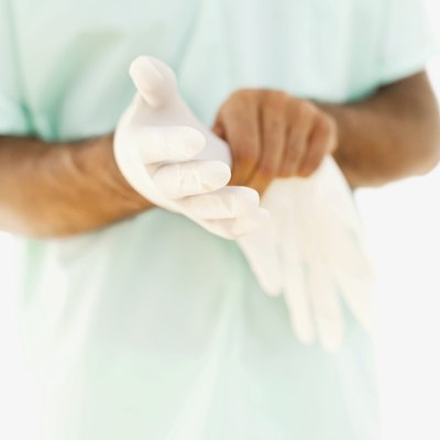 Man wearing medical gloves