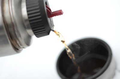 coffee pours from a thermos.