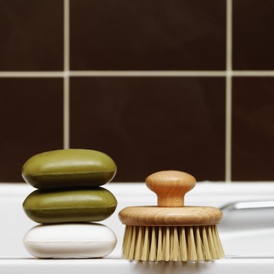 Present special soaps and lotions in a basket with aromatic oils, bath crystals, cologne and high-end shampoos.