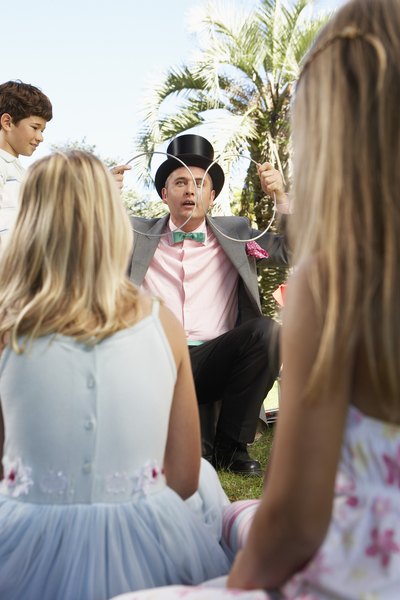 Magician performing at birthday party