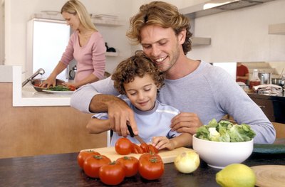 Father and son preparing food