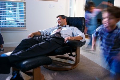 Sleeping in a recliner.