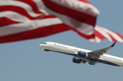 Delta Airlines passing an American flag