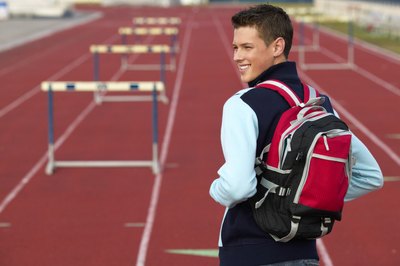 Teenage boy on track with backpack