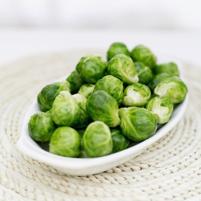 A bowl of fresh brussels sprouts.