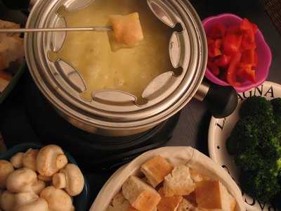 An overhead view of the components of cheese fondue.