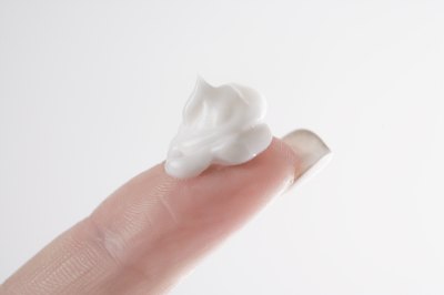 topical medication on woman's finger