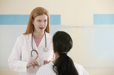 Doctor speaking with patient in office.