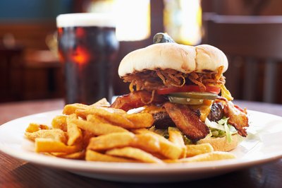A burger with french fries.