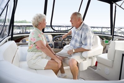 Senior couple talking on boat