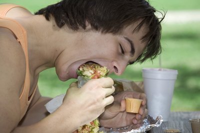 Man chewing sandwich