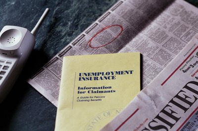 Unemployment insurance information with newspaper.