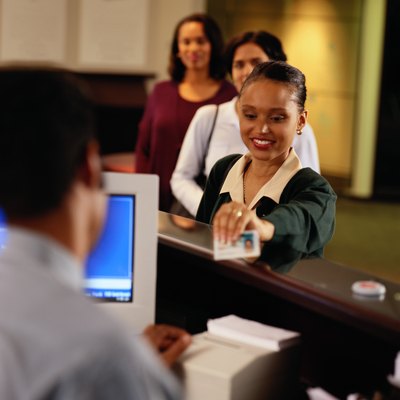 Woman presenting identification at counter