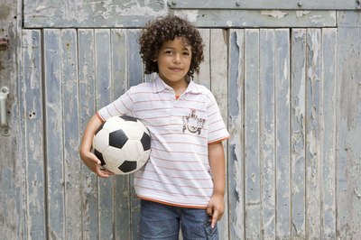 young boy with soccer ball