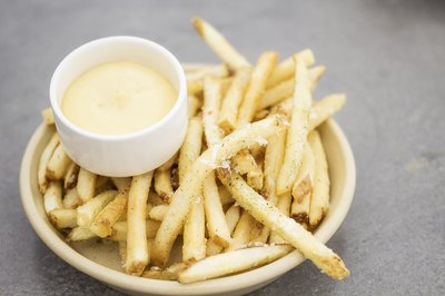 Creamy aioli makes a great accompaniment to deep-fried foods like French fries.