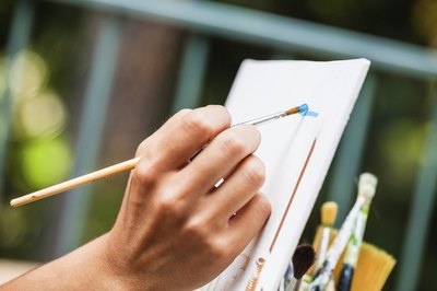 Close-up of hand holding paintbrush