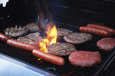 hamburgers and hot dogs on the barbecue