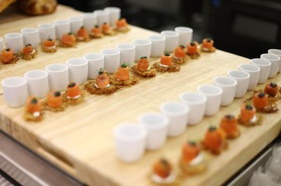 Smoked salmon, caviar, dill-sour cream, potato cake appetizer at culinary event