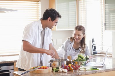 Couple cooking in kitchen