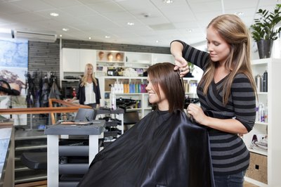hairdresser styling woman's hair