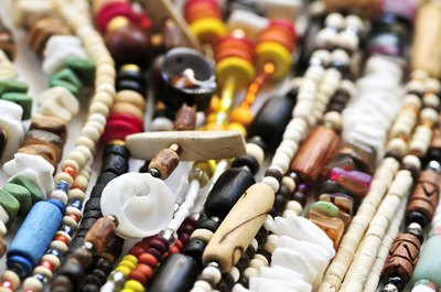 African people also make beads out of natural materials like bone, hell, wood, amber and glass.