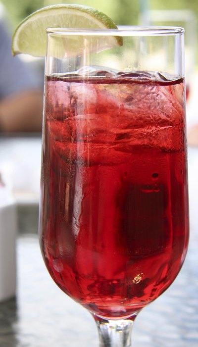 Glass of cranberry juice with lime