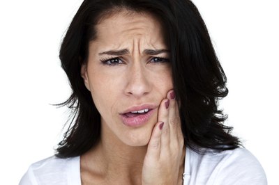Woman with pain in her mouth.