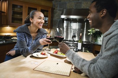 A couple toast with red wine