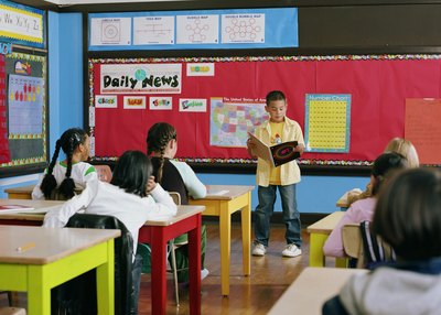 Boy reading in class