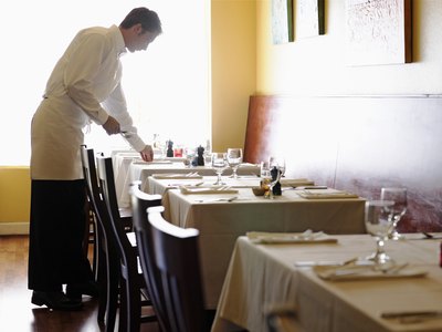 Waiter setting table