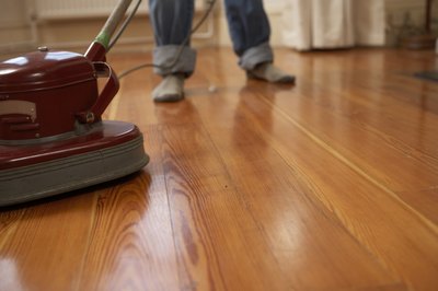 Oak floors with tinges of red give the area a cozy and inviting feel
