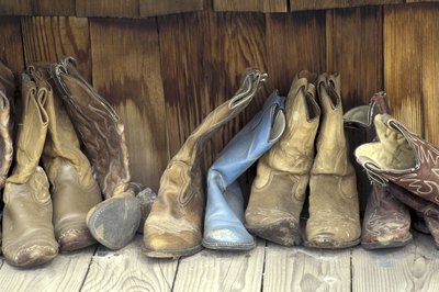 Shoes made out of leather and synthetic components protect feet from harmful elements and provide support.
