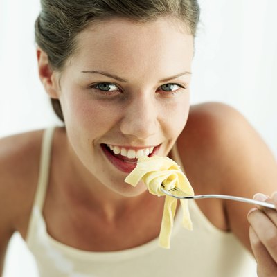 Woman eating pasta