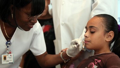 Child receiving the Flu Mist Vaccine