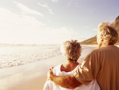 Mature couple walking on the beach