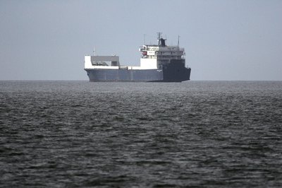 A cargo ship on the open water.