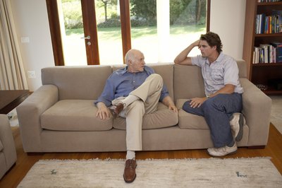 Men talking on couch