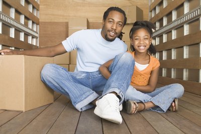 Father and daughter in portable storage unit