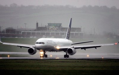 Continental Airliner touching down in the rain