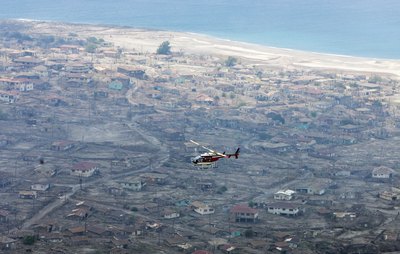 Helicopter hovers over destroyed capital Plymouth, Montserrat