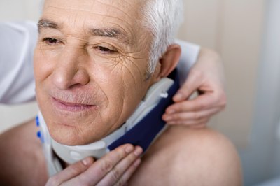 Neck brace being put on patient