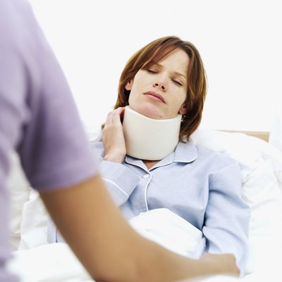 Woman wearing neck brace in pain