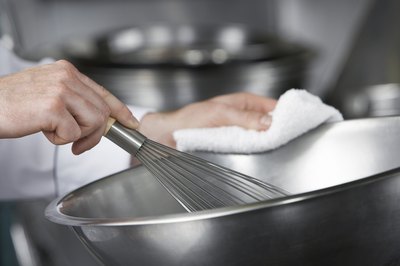 Chef mixing with whisk